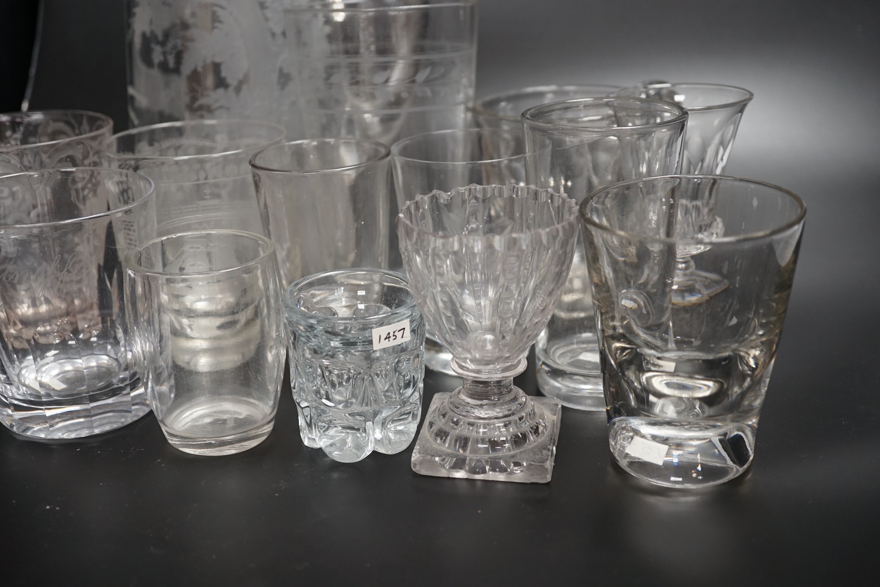 Fourteen 19th century glass items, including a jug heavily engraved with a scene of a stag in a woodland glade, an engraved Sunderland Bridge tumbler, together with another three engraved tumblers, plus some smaller brea